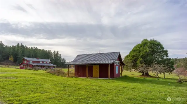 The farmstand in foreground, farmhouse in left background, sequoia to the right