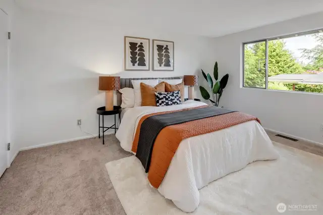 Primary bedroom with walk-in closet and ensuite three-quarter bathroom