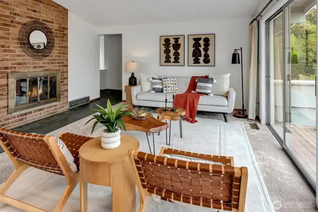 Lovely mid-century home with wood burning fireplace, slate floors, and new carpet on the upper level