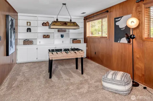 Rec room with built-in storage cabinets