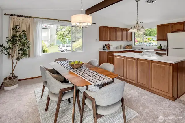 Open Kitchen and dining room with large center island with quartz counters