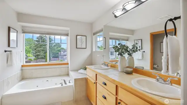 Thoughtfully designed five-piece bath, including a jetted tub and dual vanities.