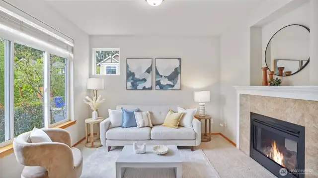 Formal living room anchored by a charming two-way gas fireplace.
