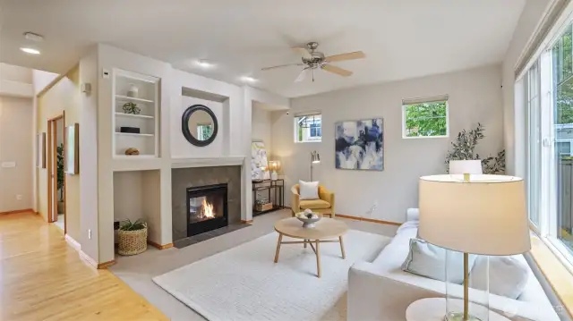 Two-way gas fireplace also warms the open-concept family room with custom built-in bookcases.