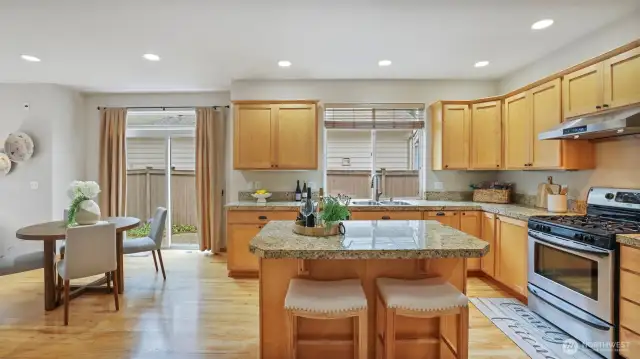 Rich maple cabinetry and elegant hardwood flooring.