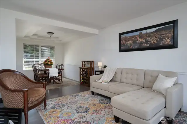 staged living room area and dining room