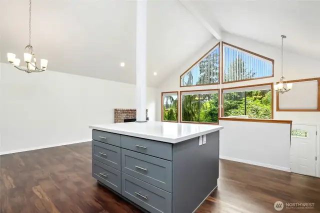 Open living & brand new kitchen with vaulted ceilings, dining area leads to large deck & fence backyard with all new floors.