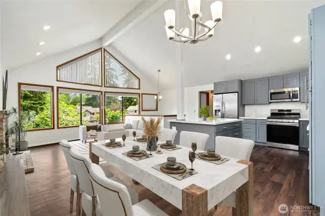 Open living & brand new kitchen with vaulted ceilings, dining area leads to large deck & fence backyard with all new floors. (Virtually staged)