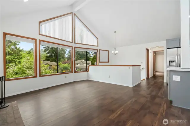Open living with vaulted ceilings, abundance of natural light with wall of windows & all new floors.