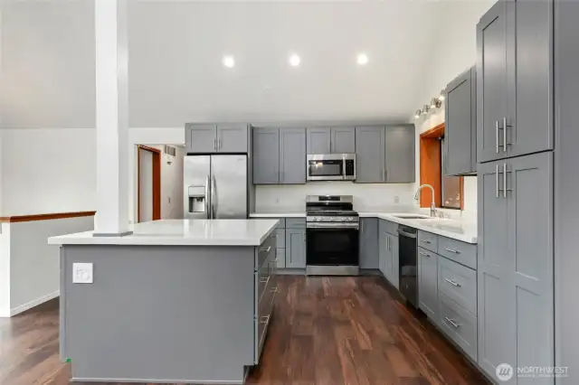 Newly updated kitchen with quartz counters & all new appliances.