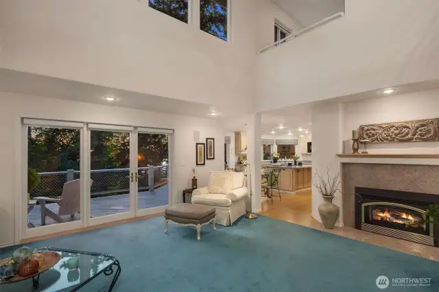 This custom three-story home features vaulted ceilings, extensive skylights, built-in vacuum system and a large deck running across the back of the home.