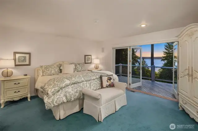 Generous primary bedroom will be your own personal retreat with serene views from the deck.