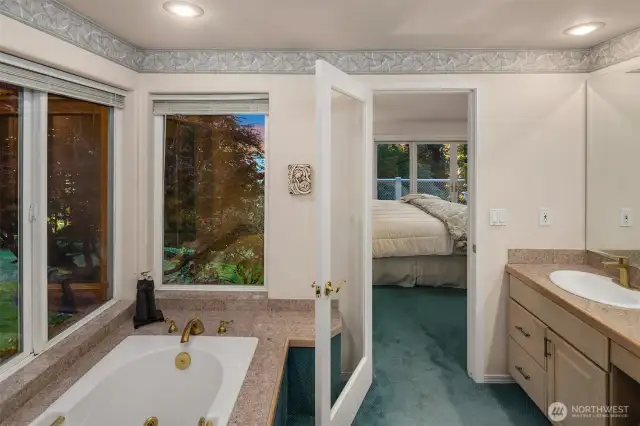 The ensuite bathroom is handsomely dressed with a jet tub to relax and unwind.