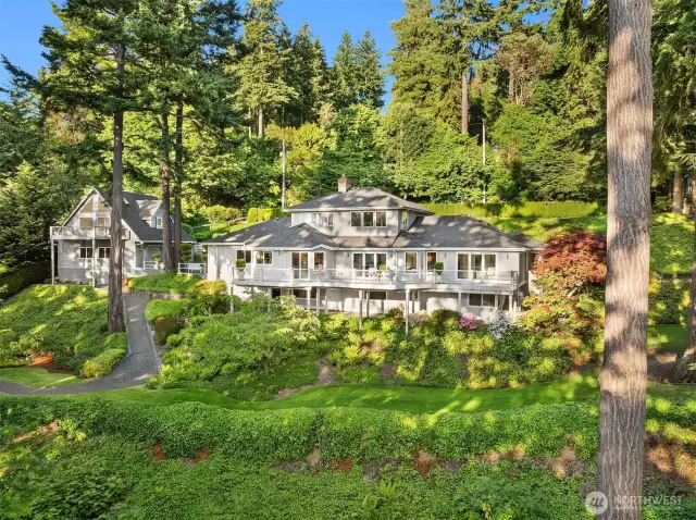 Impeccable landscape surrounds the home.