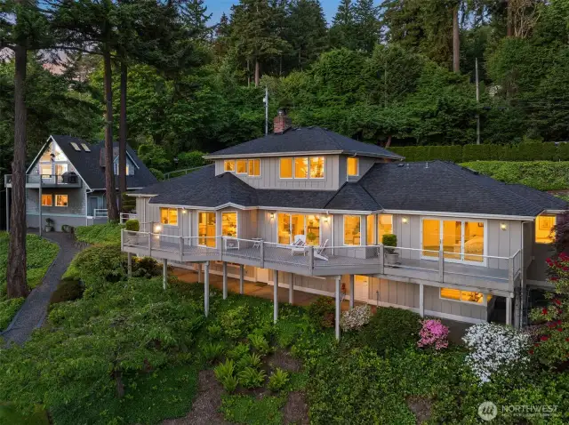 Expansive deck runs across the back of the home for maximum outdoor entertainment.