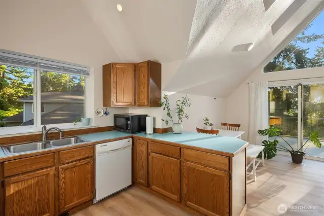 Natural light flows throughout the dining and kitchen space.