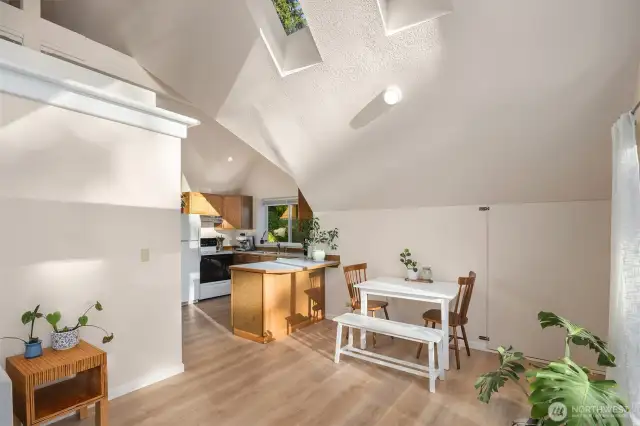 Vaulted ceiling with skylights highlights the living space.