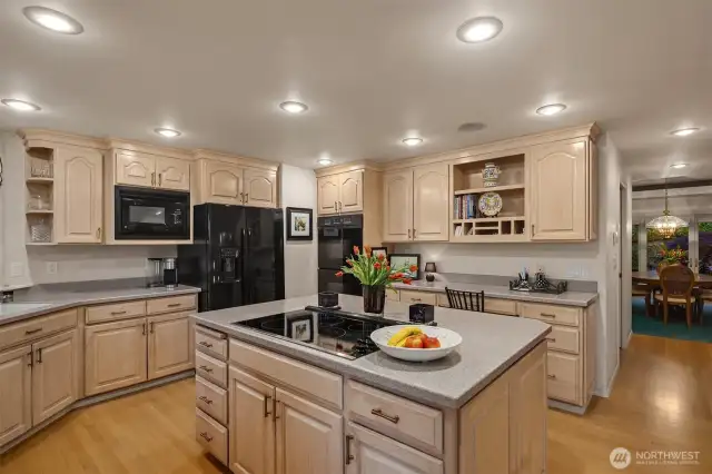 Gourmet kitchen boasts of blonde cabinetry with complementing countertops.