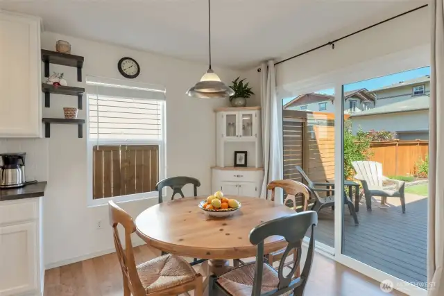 Breakfast nook and slider to private backyard