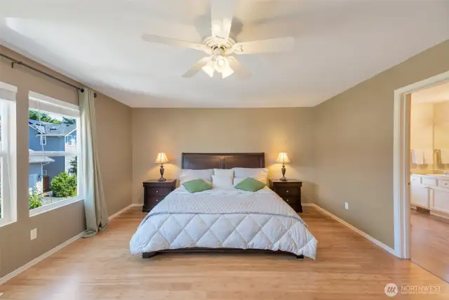 Primary bedroom with 5-piece bath and walk in closet