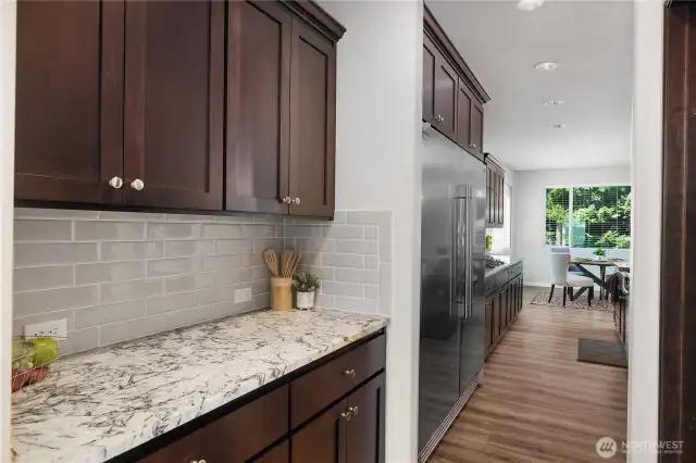 BUTLERS PANTRY WITH A FULL STORAGE PANTRY TOO