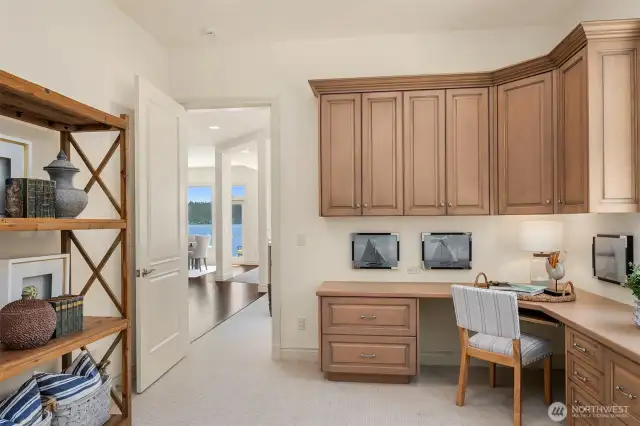 Main floor office with closet and adjacent bath.