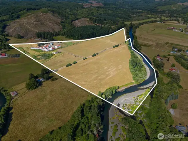 Facing NE towards Wynoochee Vly Rd. Wynoochee River runs along S boundary. Property lines approximate.