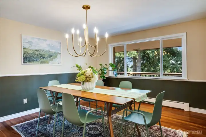 Hardwoods extend throughout the main floor into this dining room adjoining the kitchen.