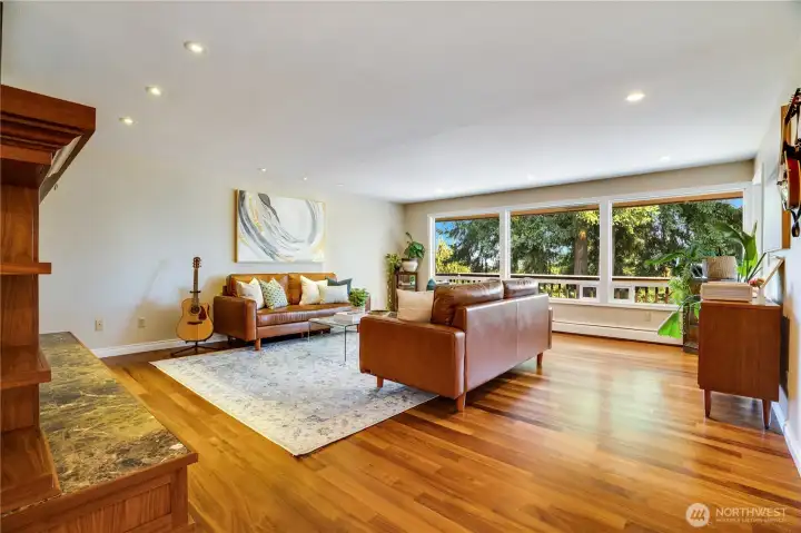 Take the hall past the dining room to the formal living room. Set aside from the activity of the kitchen and family room, this is another cozy place to enjoy the fireside.