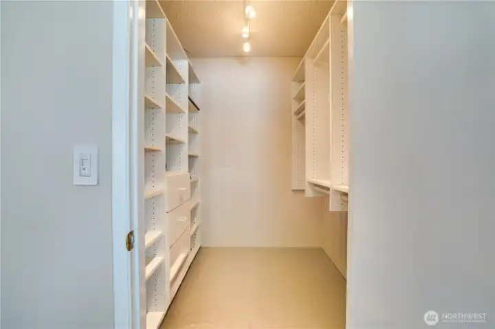 The walk-in closets include shelving and drawers to help keep items tidy and organized.