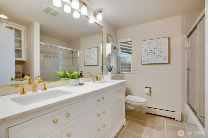 The 2nd floor full bath is updated with a brand new vanity with double sinks. Like the other bathrooms, you'll notice there's no lack of storage space.