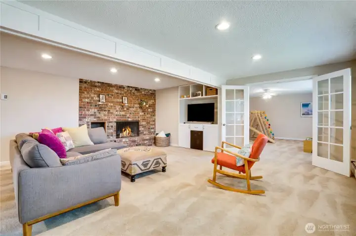 It's time to visit the finished daylight basement with its living room, bonus room/playroom, kitchenette, 2 bedrooms, 3/4 bath, storage room, boiler room with a brand new boiler, and sliding glass doors to the patio.