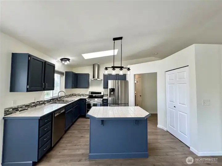 Sleek kitchen with newer stainless-steel appliances.