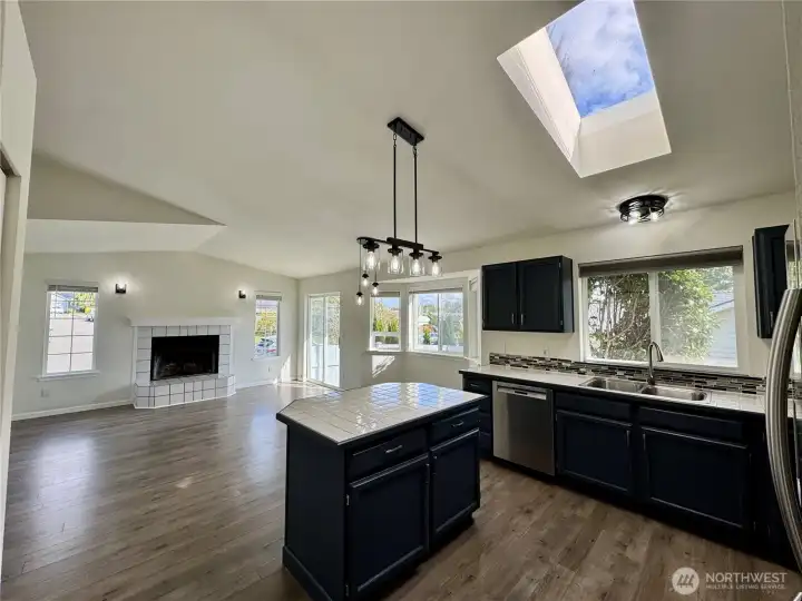 Great open floor plan leading from kitchen into dining area.