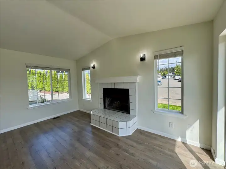 Cozy dining space highlighted by the wood-burning fireplace.