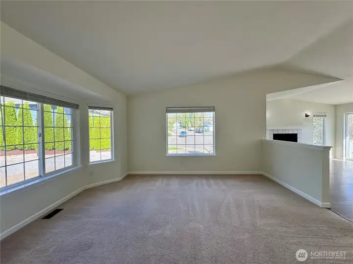 Inviting living room welcomes you at the front entrance, with beautiful windows.