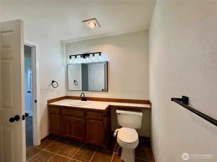 Full bathroom in hallway.