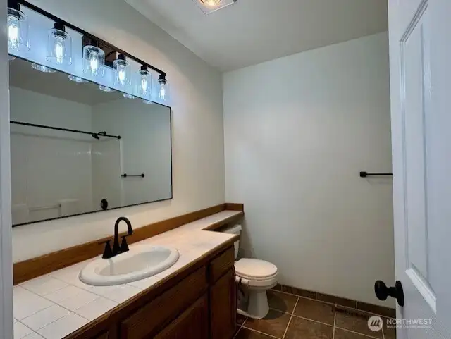 Lots of counter space in bathroom off the hallway.