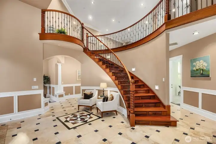 Stunning grand entrance with warm cherry wood, heated marble and luxurious finishes throughout