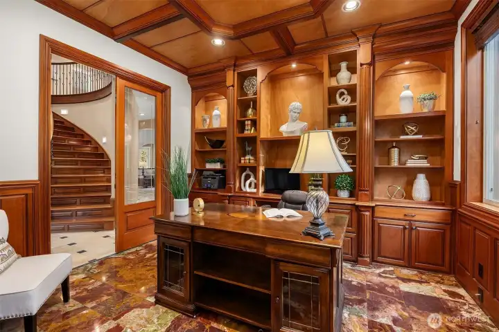 Profession office, wood wrapped with custom shelving and beautiful red Onyx flooring