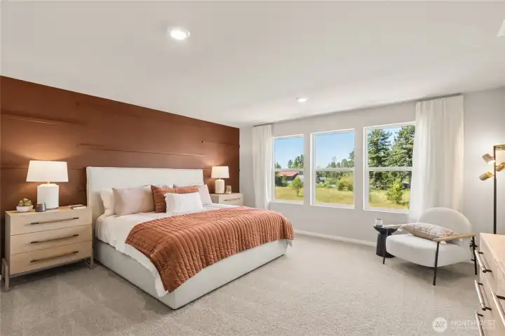 Huge primary bedroom suite with 3 large windows for light. Actual home is under construction and finishes, materials, and colors will vary. See site agent for details.