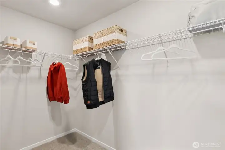 Large walk-in closet off primary bedroom. Actual home is under construction and finishes, colors, and materials may vary. See site agent for details.