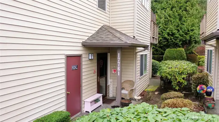 Covered side entrance and a 1 car garage.