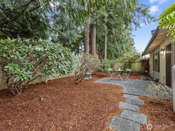 Freshly barked gardens await the Spring blooms.