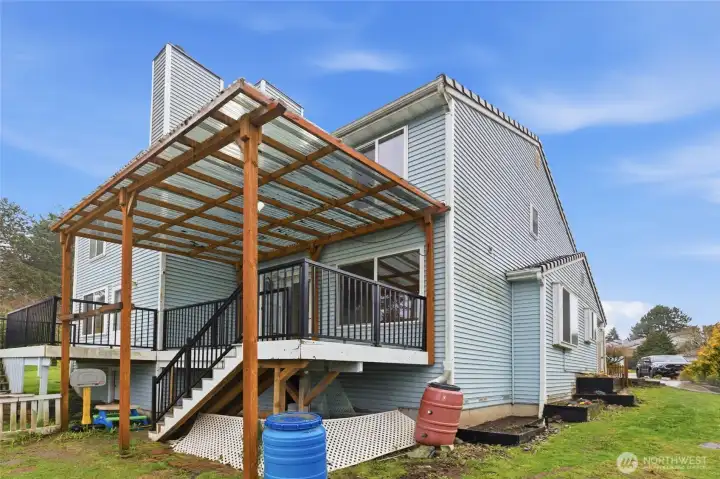 Private backyard with garden beds, ideal for gardening enthusiasts