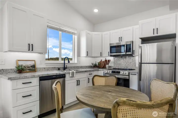 Fantastic kitchen is a true highlight!  Features include beautiful countertops, ample storage and stainless steel appliances!