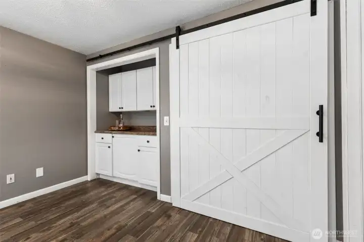 Extra storage in this space, barn doors to close either side.
