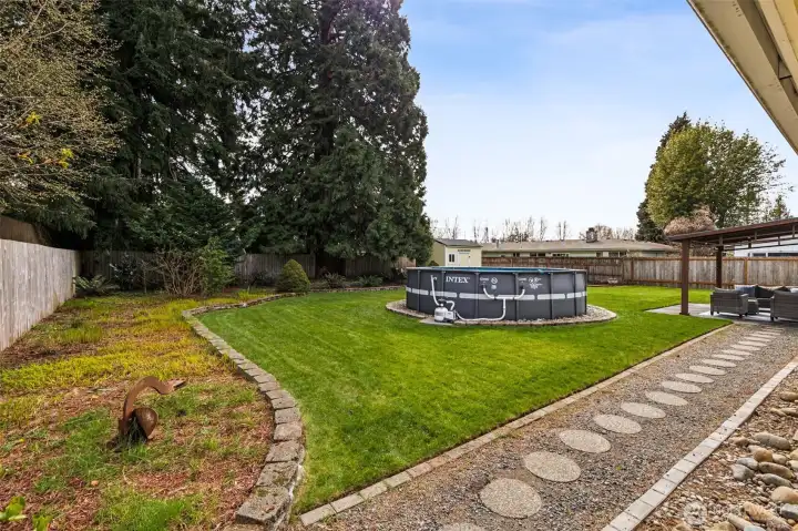 Large yard, above ground pool, lots of room to play or just relax.