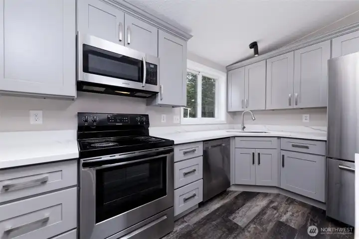 Really nice appliances and cabinets.