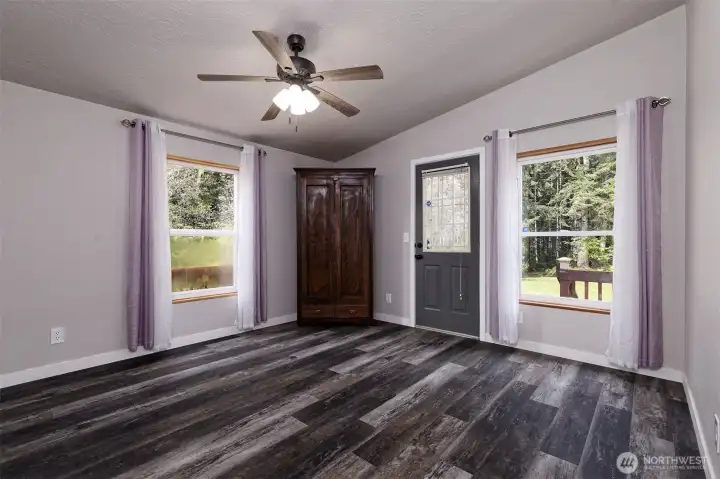 Bedroom at the other end of the house, with a door to the deck.